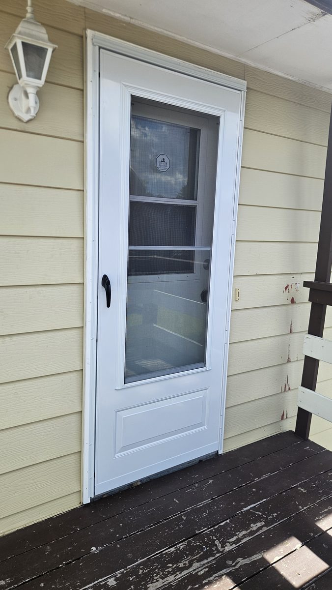 EMCO 100 Series storm door installed after wind damage in Pineridge, Calgary