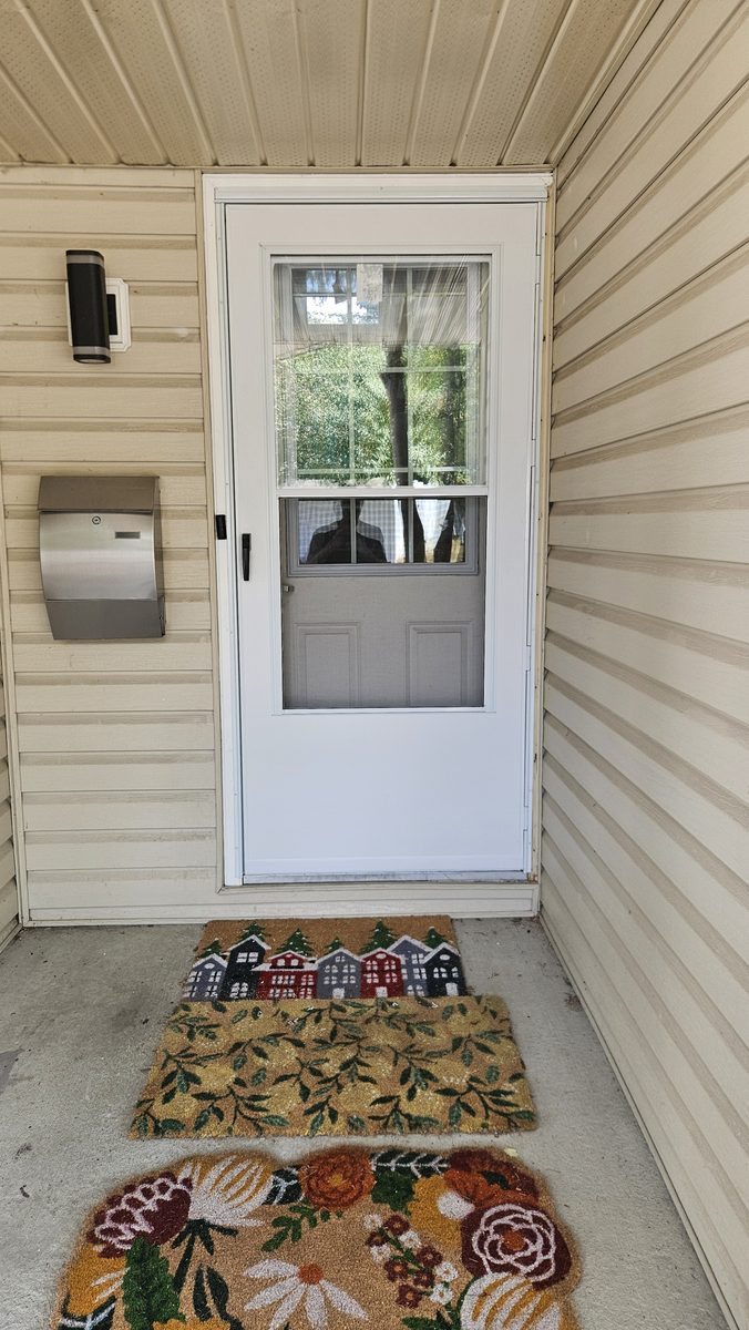New white EMCO 100 Series storm door installed in Calgary