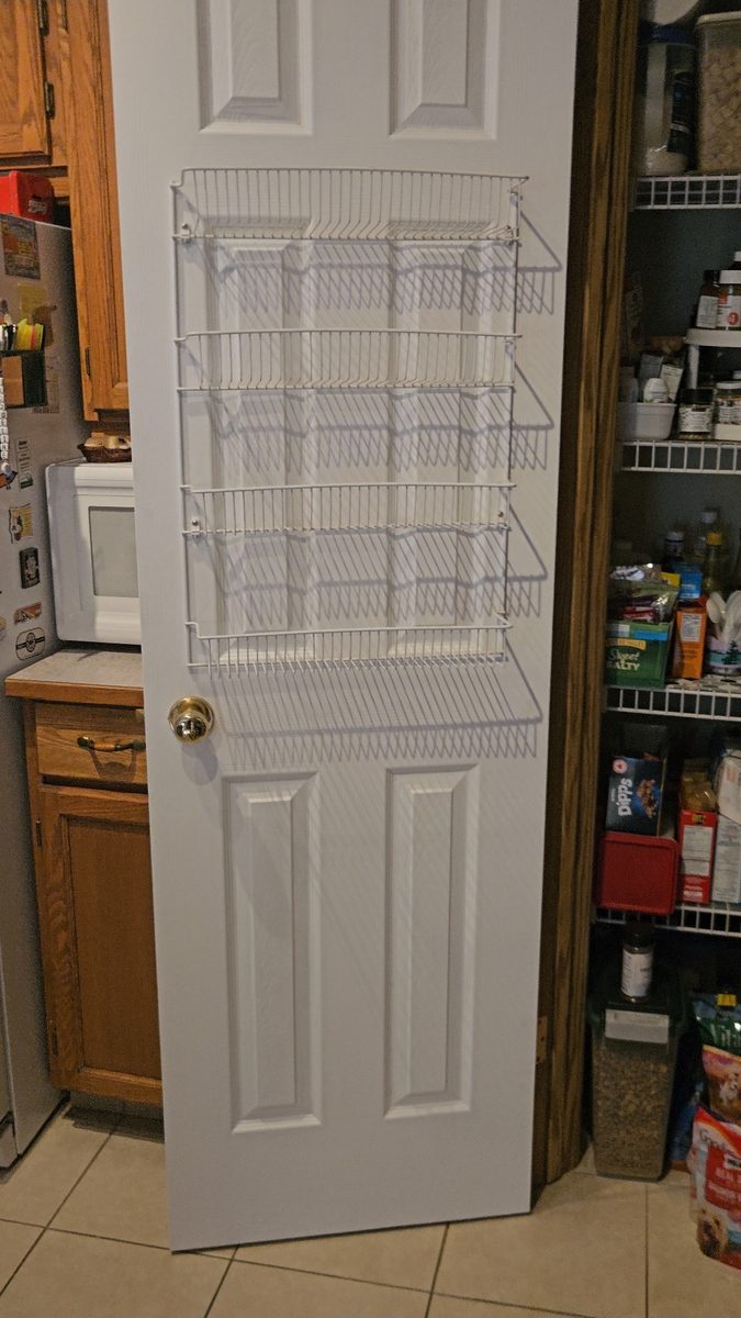 Over-door spice rack installed on new pantry door in Harvest Glen, Calgary