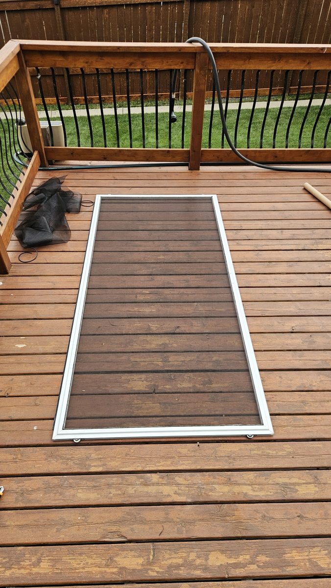 Patio screen door re-screened with pet-friendly mesh in Sherwood, Calgary