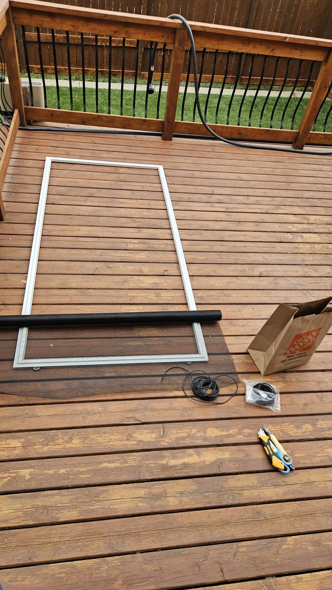 Patio screen door frame stripped for re-screening in Sherwood, Calgary